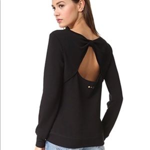 Black Kate Spade sweater with back cut-out